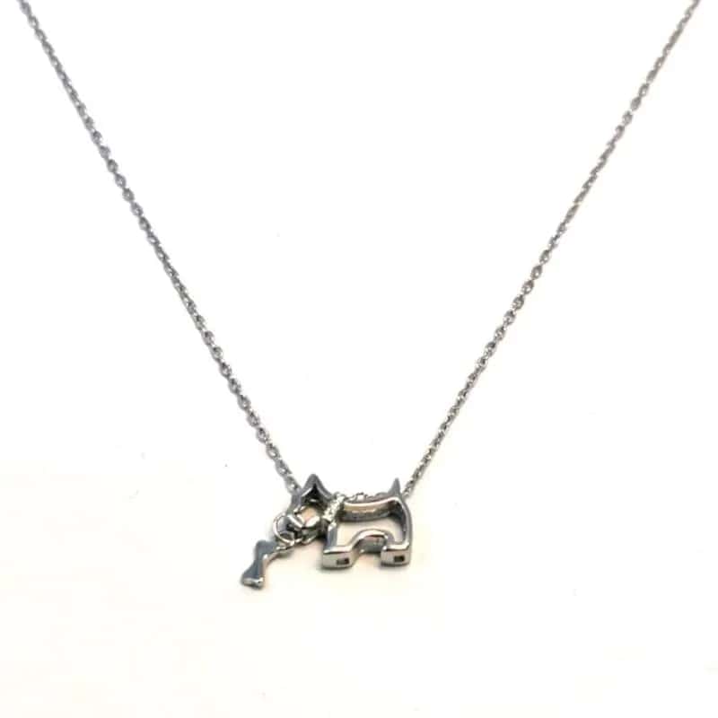 Silver necklace with white stone dog pendant - playful bone in mouth